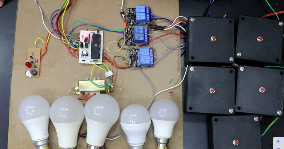 Five Candidates Quiz Buzzer project using 8051 microcontroller with relay-based AC bulb system.