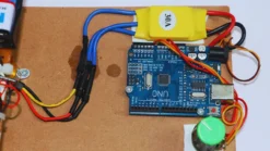 Close-up of Arduino Nano circuit controlling 8 LEDs for POV display project with motor mount
